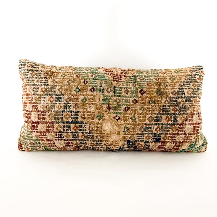 12 x 24 inch lumbar pillow made from a vintage Turkish textile. Geometric pattern woven in sun-faded hues of sage, emerald, blue, lavender tan and sepia. Wear is a sign of the vintage aspect of the textile. Solid mocha brown back with zip closure.