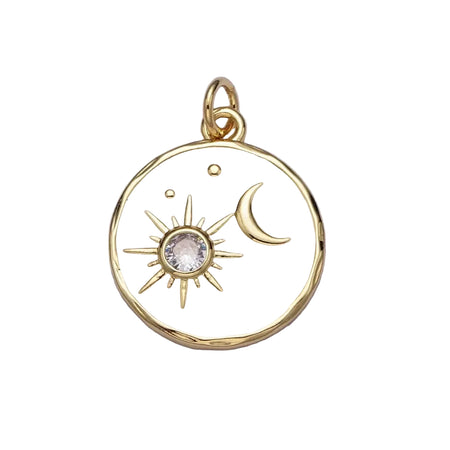 Round gold and white enamel pendant charm with a golden moon and sun with a sparkling CZ stone. 14K gold plated over brass. 