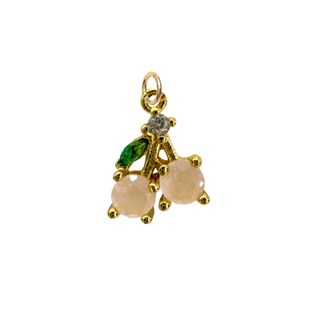 A delicate cherry charm with pale pink and green CZ stones set in golden fittings. Water resistant and tarnish proof. .5 inch length.