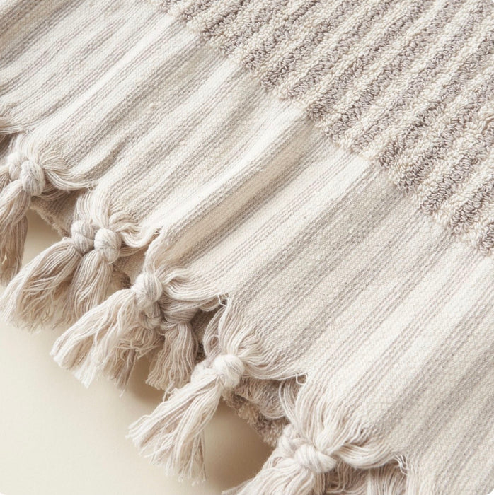 Close-up of the hand knotted fringe border on the Aubrey Towel. 