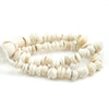 A coiled strand of white shells strung on hand braided cord. 15" length. 