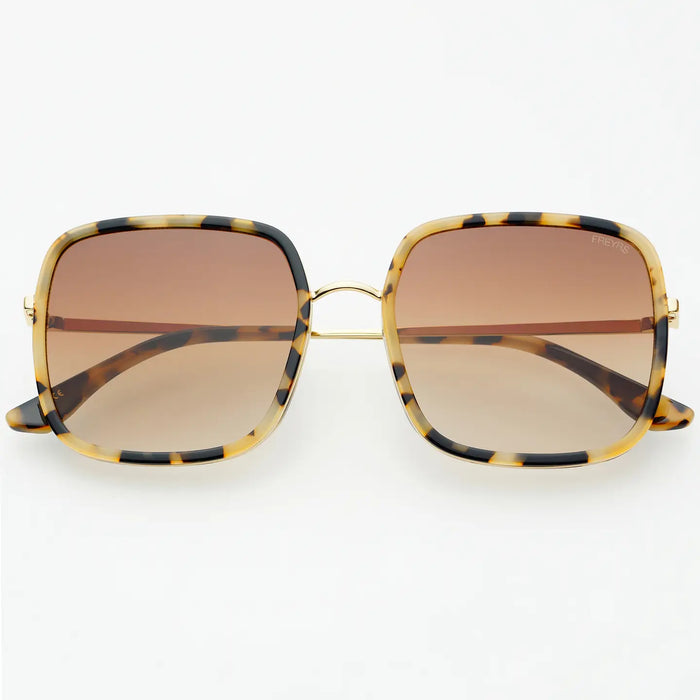 Sunglasses with a brown tortoise frame and softly tinted brown lenses on a white background.