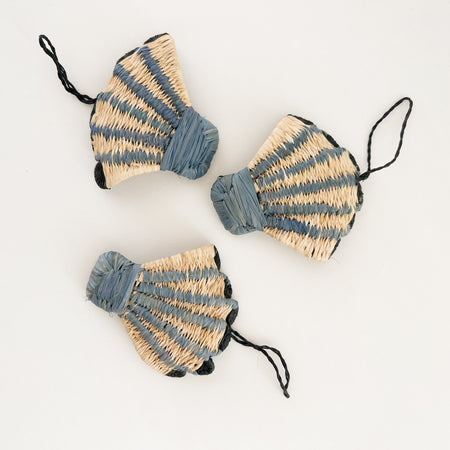 Seashell ornament hand woven in natural and blue raffia. Each shell sold separately. Hand crafted by skilled artisans in Uganda.