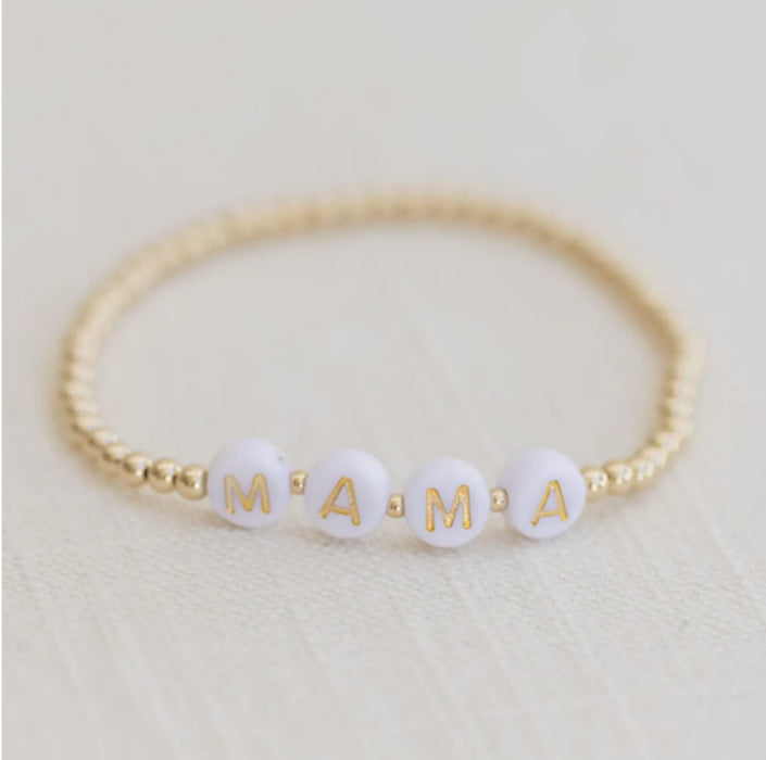 Mama Bracelet. White alphabet tiles spelling out Mama strung with 14k gold filled 3mm balls. Stretch bracelet, 6.5" one size fits most.