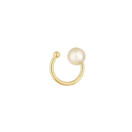 Delicate gold ear cuff with a solitaire white pearl. 18k gold filled, simulated pearl. Hypoallergenic and waterproof.
