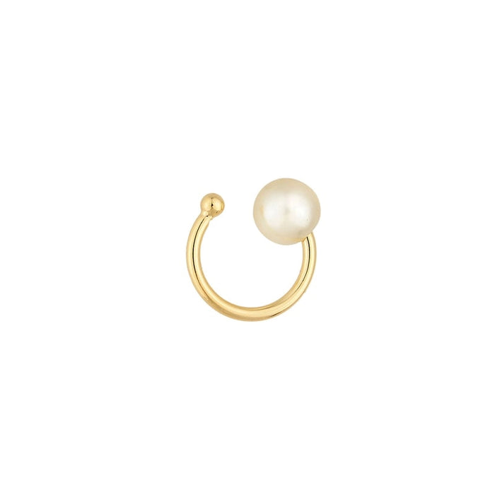 Delicate gold ear cuff with a solitaire white pearl. 18k gold filled, simulated pearl. Hypoallergenic and waterproof.