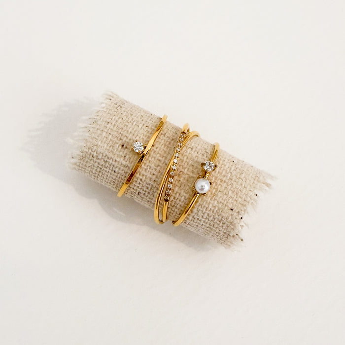 Three gold rings stacked together. The Bree, the Mia and the Eloa rings. Each sold separately.