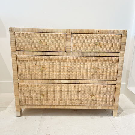 Delray chest of drawers/dresser.  6 drawer dresser made of solid wood hand wrapped in natural rattan with woven rattan panels on sides, top and drawer face. Finished with clean brass leg caps and minimalisic brass pulls. Perfect for the modern coastal home.
Measures: 36"W x 18"D x 30.5"H