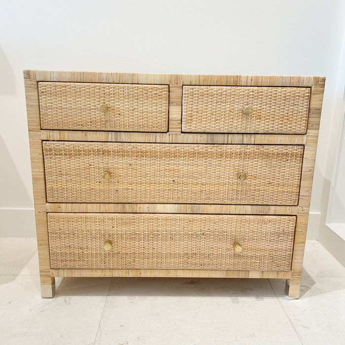 Delray chest of drawers/dresser.  6 drawer dresser made of solid wood hand wrapped in natural rattan with woven rattan panels on sides, top and drawer face. Finished with clean brass leg caps and minimalisic brass pulls. Perfect for the modern coastal home.
Measures: 36"W x 18"D x 30.5"H