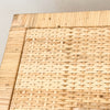 Close up detail of finishing on the Delray chest of drawers/dresser. Solid wood frame hand wrapped in natural rattan with woven rattan panels on sides, top and drawer face.