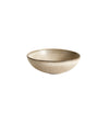 Small irregular shaped ceramic bowl with an oyster-grey glaze. Measures 5.7 x 6.1 inches.