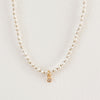 Petite white pearl necklace with a gold filled and CZ crystal charm. 15" length with a 2" extender.