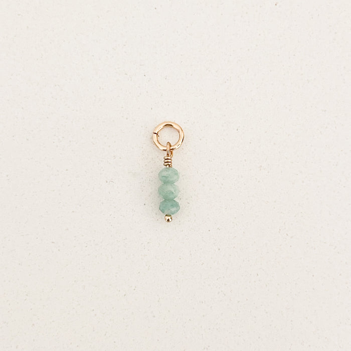 Mini Amazonie charm. Three tiny aqua blue stones stacked on gold filled charm ring. Designed to layer onto any of our charm builder necklaces or earrings.