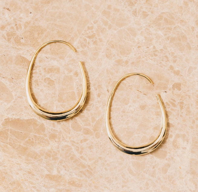 Modern threader hoop earrings. Organic oval shape hoop threader earring made of 18k gold on a copper base. Dimensions 1.5" x 1"