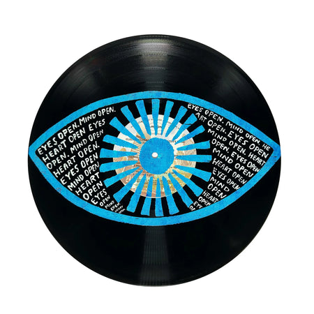 Vinyl record with a blue and white eye design and text on a white background