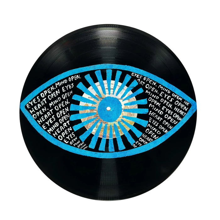 Vinyl record with a blue and white eye design and text on a white background