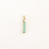 Rectangular crystal baguette charm in a pale seafoam green color with gold filled fittings. Measures 1" long.