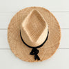 Top view of shaped Boheme Raffia Hat with black suede and cotton gauze strap tied around crown.