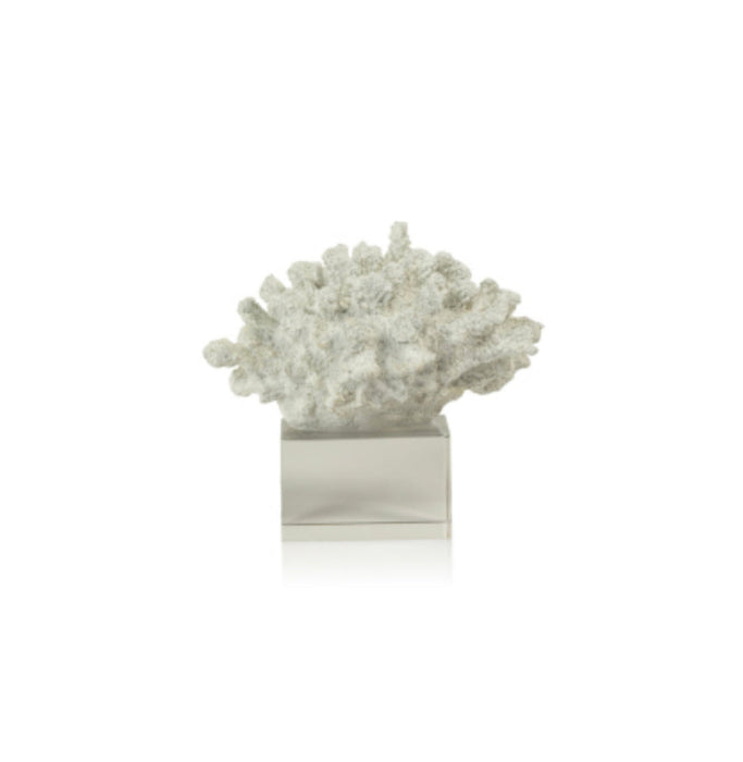 Artificial white coral on a clear acrylic stand.