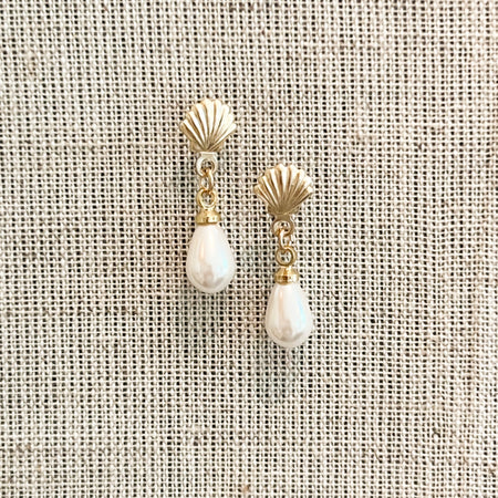 Beyond the Sea earrings feature 14k gold filled shell stud earrings with a natural pearl drop. Handcrafted in the U.S.