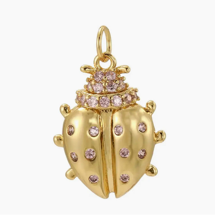 Golden Scarab charm encrusted with pale pink CZ stones. 20 mm length x 15 mm width.