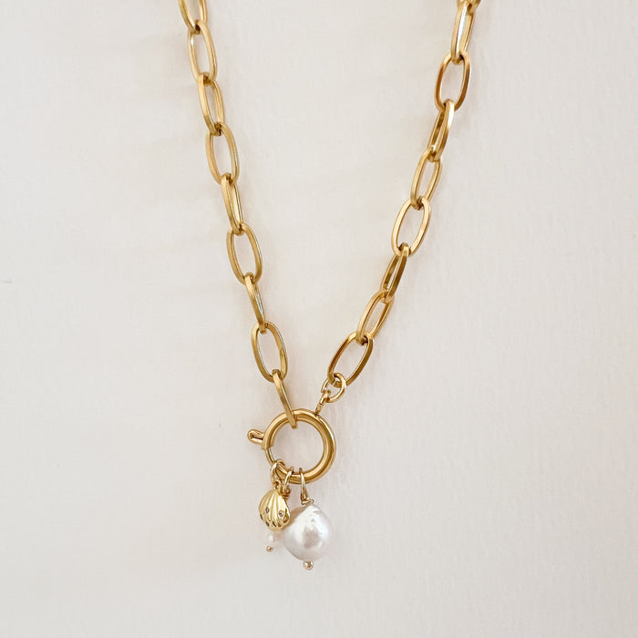 Harlow charm builder necklace shown with 3 charms strung on the round sailor clasp. All charms sold separately. Necklace can be worn as a chic classic chain or layer charms onto it for a personalized look.