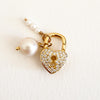 Heart shaped gold and pave' lock carabiner shown with a solitaire pearl and a trio of small pearl charms, each sold separately.