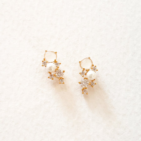 Pair of delicate climber earrings with post. Cluster of mini pearl, white rock crystal and clear CZ set with gold filled fasteners.