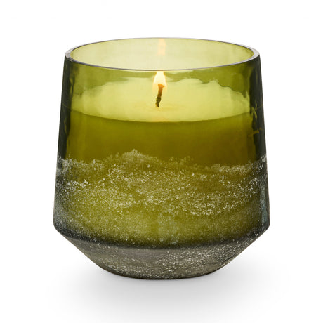 Balsam + Cedar holiday candle by Illume. Fragrance grounded in rich oak moss with a heart of fir needle kissed with warm cinnamon. Luxury plant-based, clean burning candle hand poured in a sanded evergreen colored glass vessel. 13 oz.