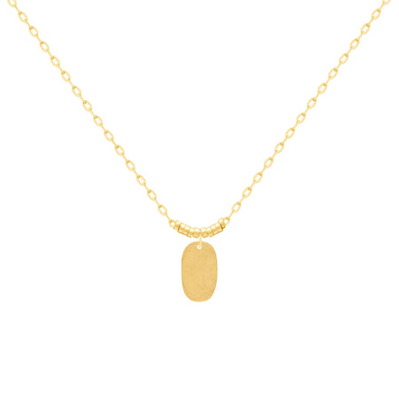 A delicate gold chain necklace with a small, hammered oval pendant, displayed against a solid white background. 18k gold over brass. 16" length with 2" extender.