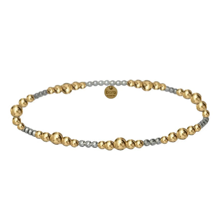 Janelle stretch bracelet. 2 tone stretch bracelet with 14k gold filled 3mm and 4mm ball beads mixed with 2mm 925 sterling silver ball beads. Stretch, one size fits most. 6.5 inch circumfernce.