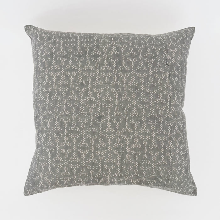 Krishna Pillow. Woodblock print pillow printed by hand in a sweet dotted floral pattern. 100% linen in soft blue grey with ecru dotted flowers. Printed face with solid ecru back. 20" square pillow with down insert.