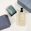 Collection of LAVUNE Dusk scented candle and hand soap with blue packaging on white background. Each sold individually.