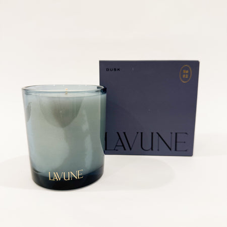 LAVUNE no. 2 Dusk scented candle in smokey blue glass vessel with dark grey box packaging. 