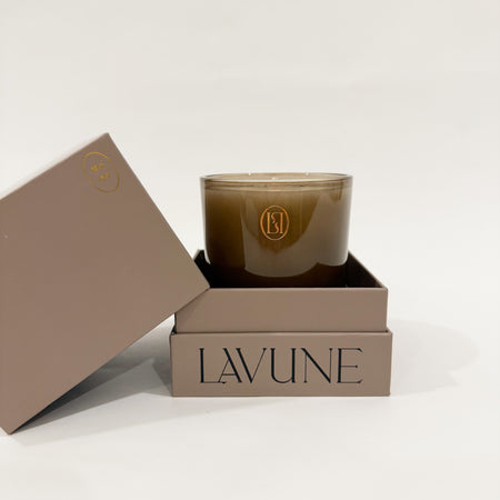 LAVUNE Santal no. 9 candle in rich taupe glass vessel packaged in a coordinating taupe box on white background.