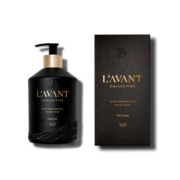 L'AVANT Fresh Linen scented hand soap in  a black glass bottle with gold branding on white background. Refillable pump bottle contains 16 fl oz.