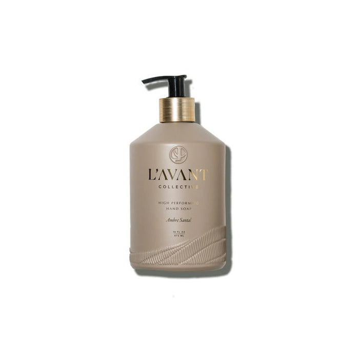 L'AVANT Ambre Santal hand soap in a taupe glass bottle with gold lettering on a white background. 16 fl oz.