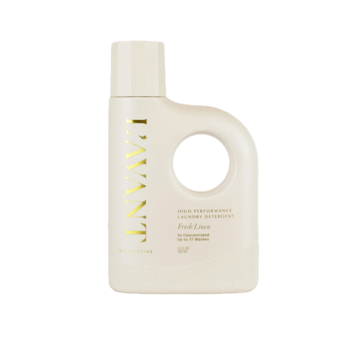 Pale beige bottle of L'AVANT Laundry Detergent with gold type. Fresh Linen scent. 32 fl oz./946 ml.