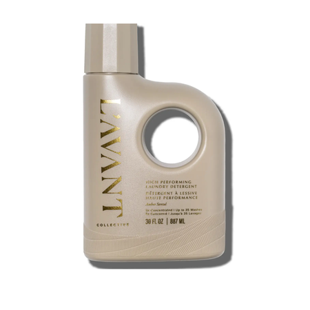  L'AVANT Laundry Detergent in a taupe bottte with gold type. Ambre' Santal fragrance. 32 fl oz./946 ml.