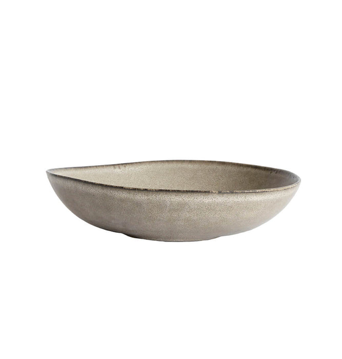 Large irregular shaped ceramic serving bowl with an oyster-grey glaze.  Measures 12.5 inch diameter.