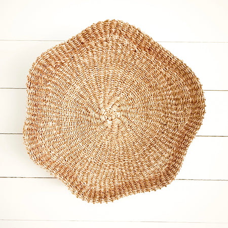 Round scallop woven tray hand crafted from natural Manila hemp. 18 inch diameter. Hanging loop on back for wall display.