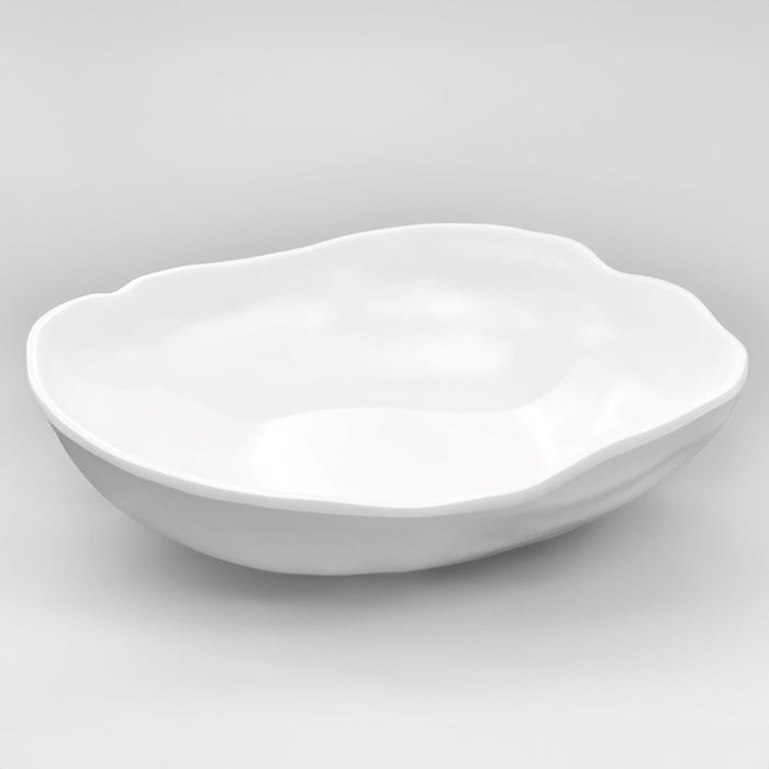 Shallow organic shaped matte white bowl made from luxury melamine. Made by Beatriz Ball. Measures: 13" diameter, 3.5" depth.