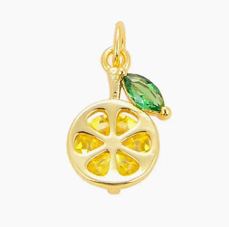 Delicate lemon slice charm with gold filled setting, yellow CZ stone and a green CZ leaf. 