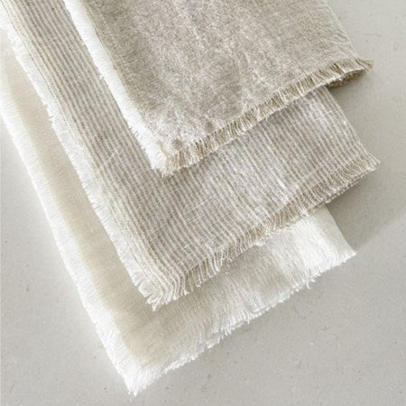 Set of 4 linen napkins. Available in a variety of colors. 100% linen with frayed edges. 20" square. 