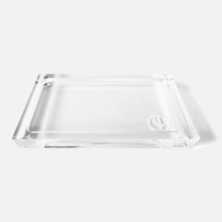 Thick rectangular lucite tray with the L'AVANT logo etched on the bottom. 7.5 x 4.2 x 1 inches.
