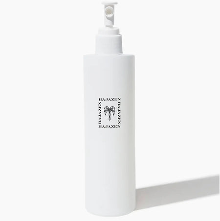 White spray bottle of MAKE WAVES sea salt hair tonic by Baja Zen. 5.5 oz. 