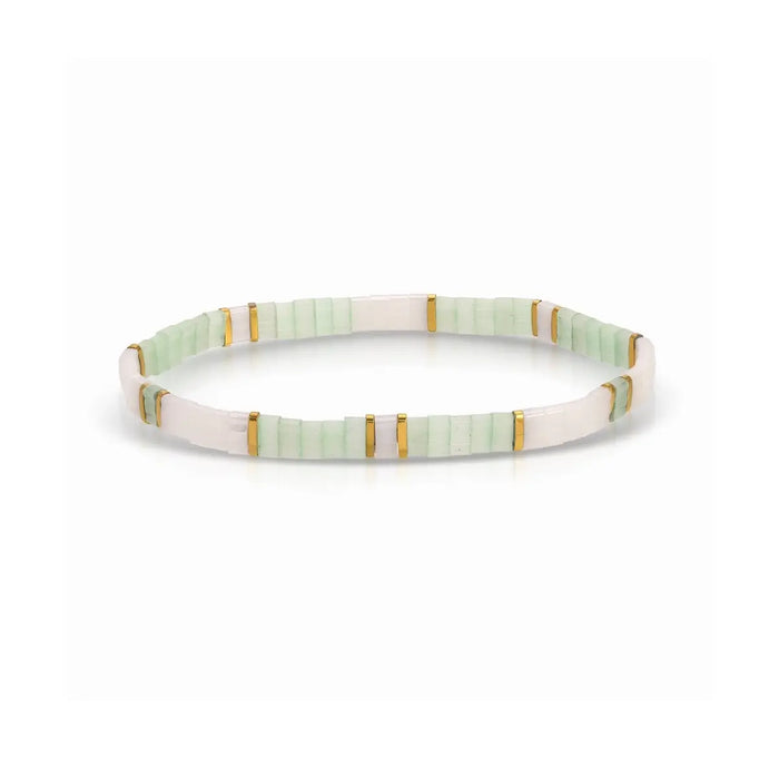 White, mint green and gold stretch bracelet made using flat, square "Tila" beads. One size fits most. 