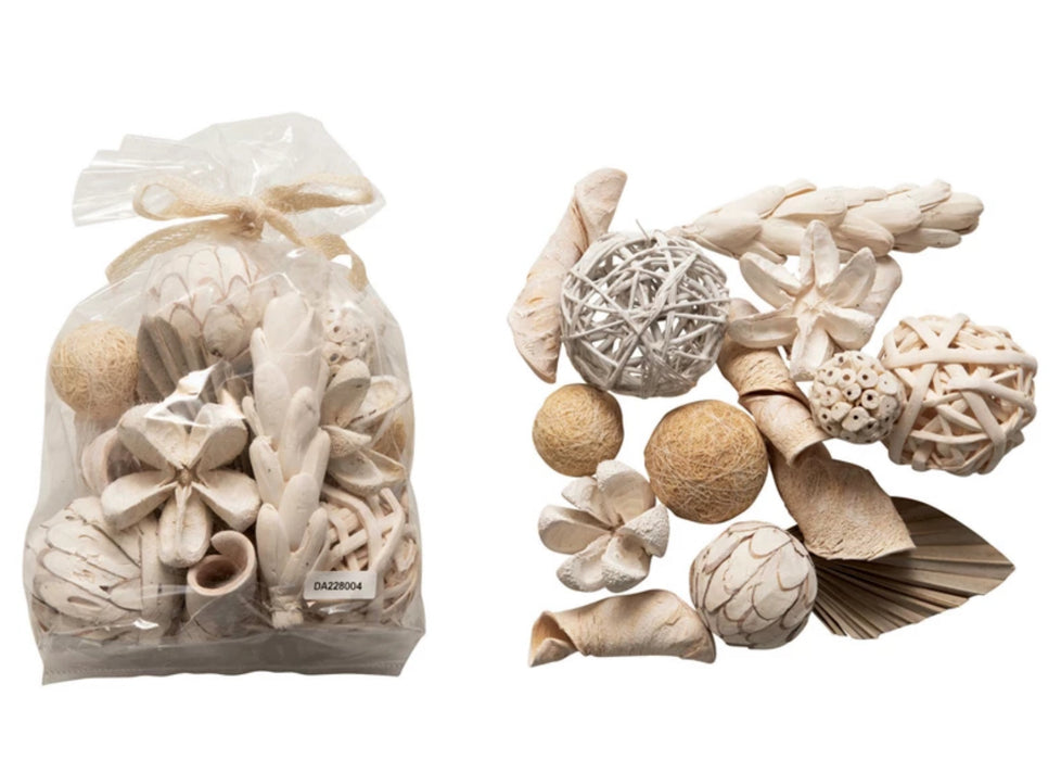 Clear bag of natural dried elements for decorative purposes.  Each bag contains a mix of dried plants, pods and wood spheres in soft shades of white and cream. Approximately 20 pieces in each bag. Use as a vase/bowl filler or as a decorative element on a wreath.