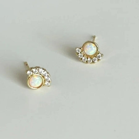 Pair of Opal studs with a halo of delicate clear CZ stones. 925 Sterling silver with gold vermeil.
