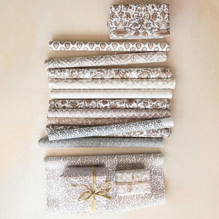 Multiple rolls of woodblock gift wrap, each roll in a different pattern. Each roll contains 3 sheets of the same pattern. Each roll sold separately. 28" x 20"